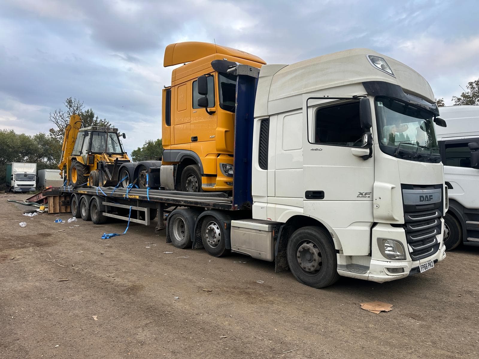 Vehicle secured on a covered transport trailer